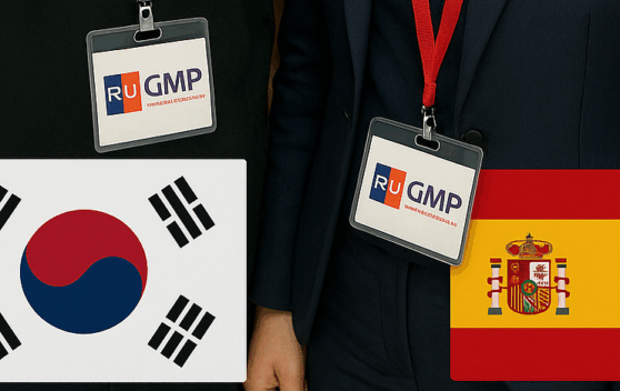 Close-up of two business professionals in corporate suits wearing official 'RU GMP' identity badges around their necks, with the national flags of South Korea and Spain superimposed on the left and right sides respectively.